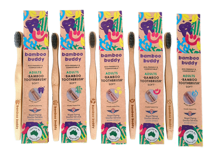 Set of Bamboo Buddy toothbrushes with colorful packaging on a white background
